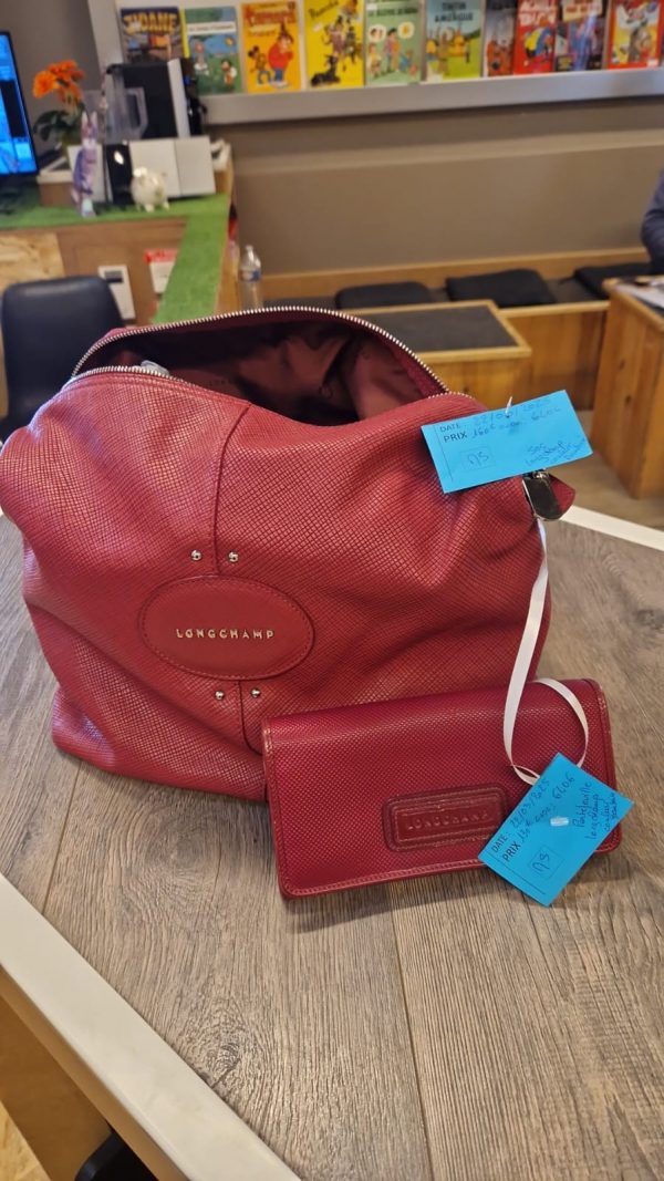 portefeuille Longchamp couleur framboise (6406).